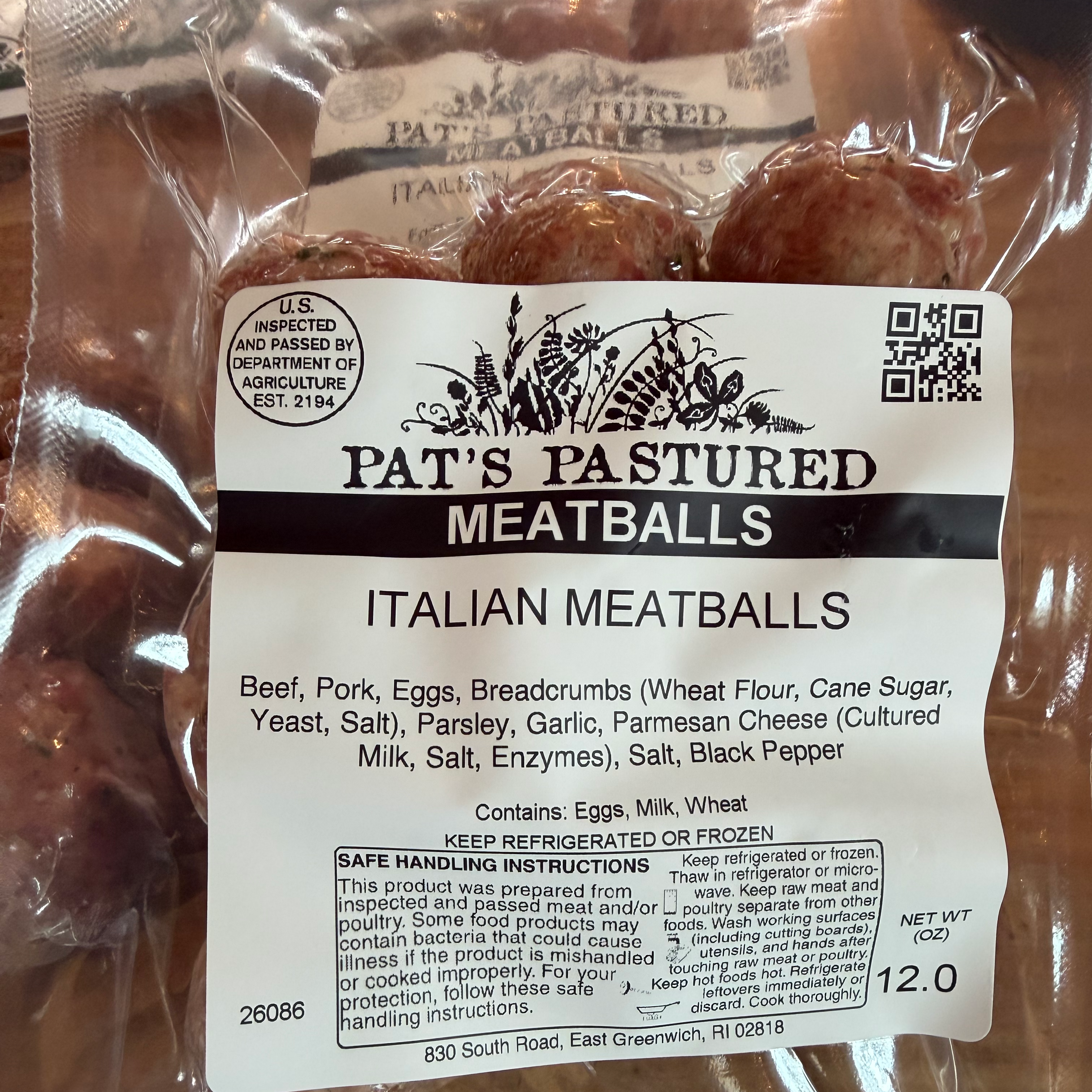 Packaged Italian meatballs with 'Pat's Pastured' label on a wooden surface